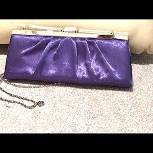 Purple Clutch, Brand New. BUY TODAY — PROCEEDS TO FAMILY HEART FOUNDATION!